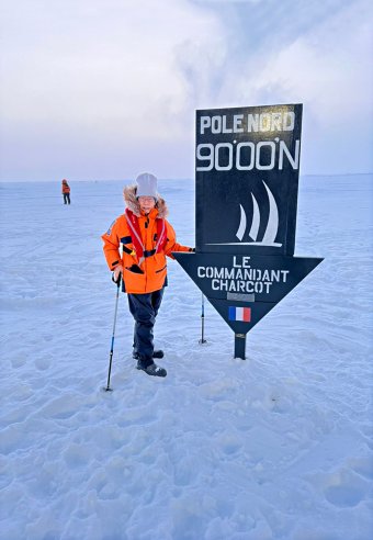 Madam Teoh Leng Lan, Executive Director of Sedunia Travel Services Sdn Bhd, standing at the Geographic North Pole 90°N