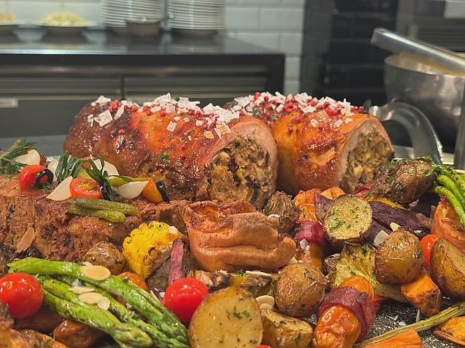 Turkey Galantine, Apple Mixed Nuts and Bread Stuffing, Grilled Sausage with Smoked Beef, Goblet Sauce and Cranberry Reduction, Yorkshire Pudding